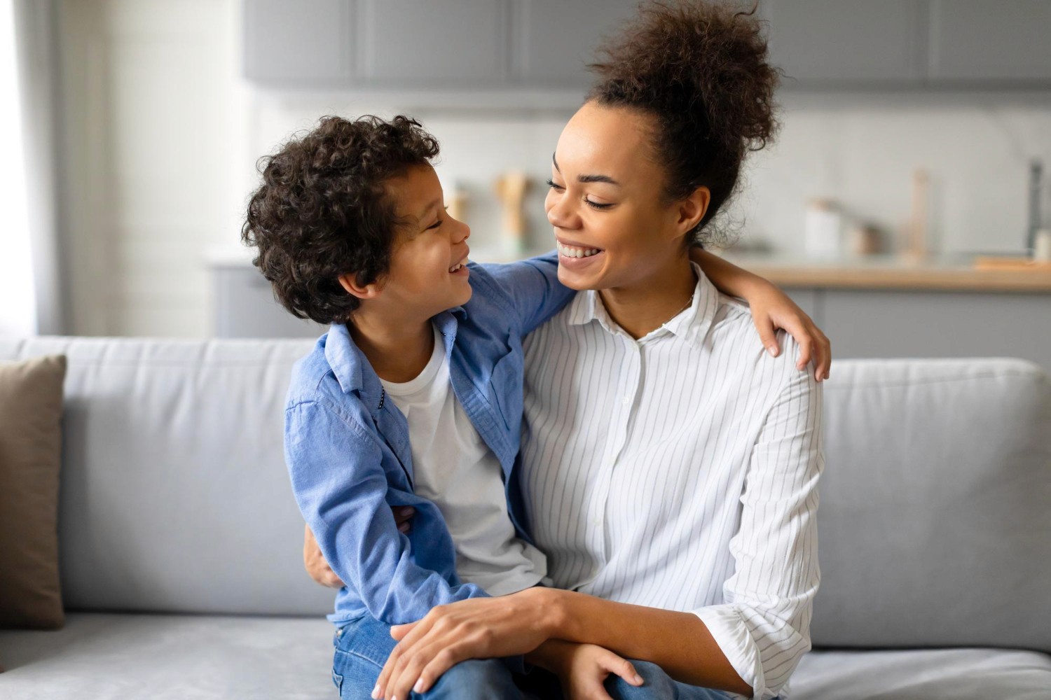 A supportive Blossom ABA team member with a child during therapy.