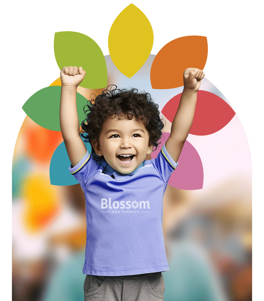 Smiling child raising arms with colorful flower petals behind them.